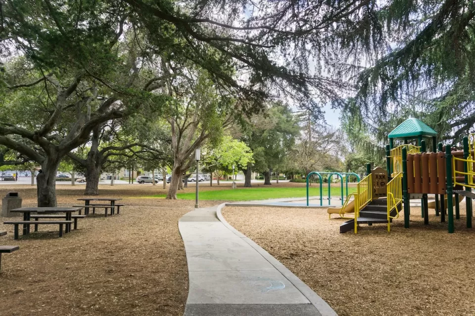 Playground and picnic benches in city park in San Francisco Bay Area.
